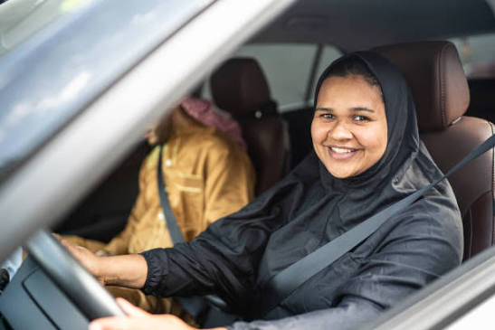A woman learning to drive with a female instructor in Abbottabad
